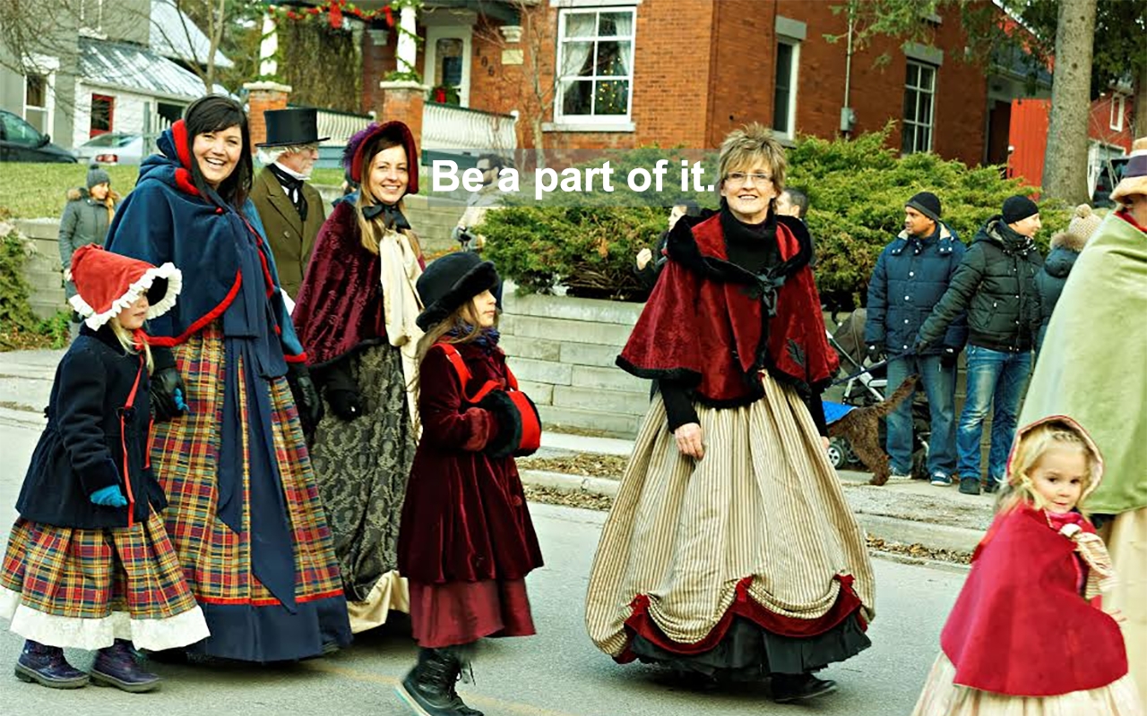 People in period costume walking in a parade